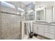 Modern bathroom featuring tiled walk-in shower with glass and a double vanity with plenty of counter space at 11862 Frost Aster Dr, Riverview, FL 33579