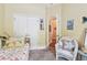 Charming bedroom with twin bed, neutral carpet, closet, and doorway at 11862 Frost Aster Dr, Riverview, FL 33579