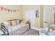 Bright bedroom featuring twin daybed, colorful decor at 11862 Frost Aster Dr, Riverview, FL 33579