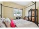 Bedroom with a four poster bed, decorative furnishings and carpet at 11862 Frost Aster Dr, Riverview, FL 33579