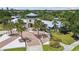 Community center with brick paved entryway, manicured landscaping, and ample parking at 11862 Frost Aster Dr, Riverview, FL 33579