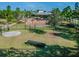 Aerial view of a fenced dog park featuring a play tunnel and well-maintained grassy area at 11862 Frost Aster Dr, Riverview, FL 33579