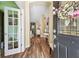Inviting foyer with wood flooring and view into a dining and living space at 11862 Frost Aster Dr, Riverview, FL 33579