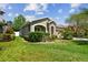 Charming single-story home with a well-manicured lawn and stone accents on the facade at 11862 Frost Aster Dr, Riverview, FL 33579