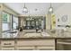 Kitchen with a granite island counter that is open to dining and Gathering rooms at 11862 Frost Aster Dr, Riverview, FL 33579