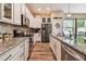 Modern kitchen with stainless steel appliances, granite countertops, and ample cabinet space at 11862 Frost Aster Dr, Riverview, FL 33579