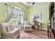 Office area with a large window, hardwood floors, and traditional furniture at 11862 Frost Aster Dr, Riverview, FL 33579