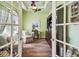 Bright office area with hardwood floors, traditional furniture, and ceiling fan at 11862 Frost Aster Dr, Riverview, FL 33579