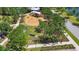 Community playground with swings, slides, and climbing structures surrounded by shady trees at 11862 Frost Aster Dr, Riverview, FL 33579