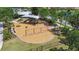 Community playground featuring swings, slides, and a merry-go-round for outdoor Gathering fun at 11862 Frost Aster Dr, Riverview, FL 33579