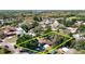 An aerial view of a single story home on a lot surrounded by mature trees at 13116 N Oregon Ave, Tampa, FL 33612