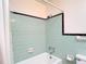 Bathroom featuring tiled shower and updated fixtures at 13116 N Oregon Ave, Tampa, FL 33612