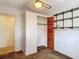 Bedroom features a fan, closet, shelving, and neutral walls and carpet at 13116 N Oregon Ave, Tampa, FL 33612