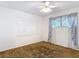 Bedroom featuring a ceiling fan and a window with curtains at 13116 N Oregon Ave, Tampa, FL 33612