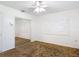 Bright bedroom featuring a ceiling fan and mirrored closet doors at 13116 N Oregon Ave, Tampa, FL 33612