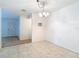 Bright dining area featuring tile floors and a modern light fixture at 13116 N Oregon Ave, Tampa, FL 33612