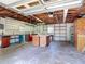 Spacious garage with workbench, ample shelving, and storage cabinets, ready for projects and organization at 13116 N Oregon Ave, Tampa, FL 33612