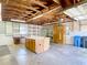 Large garage with work bench, storage, and overhead lighting at 13116 N Oregon Ave, Tampa, FL 33612