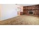 Carpeted living room with brick fireplace at 13116 N Oregon Ave, Tampa, FL 33612