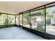 Spacious screened patio with a view of the outdoor grill and backyard at 13116 N Oregon Ave, Tampa, FL 33612