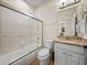 Bathroom featuring a shower over tub combination and vanity with granite countertop at 13143 Palmilla Cir, Dade City, FL 33525