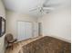 Comfortable bedroom with light-colored walls, light wood floors, and ceiling fan at 13143 Palmilla Cir, Dade City, FL 33525