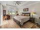 Inviting bedroom featuring a ceiling fan, a workstation, and plenty of natural light at 13143 Palmilla Cir, Dade City, FL 33525