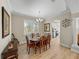 Open-concept dining room featuring a wood table, decor, and seamless flow to the kitchen at 13143 Palmilla Cir, Dade City, FL 33525