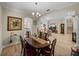 Open-concept dining area with seamless flow to the living room and kitchen at 13143 Palmilla Cir, Dade City, FL 33525
