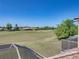 Breathtaking golf course views from home's balcony with screened lanai below at 13143 Palmilla Cir, Dade City, FL 33525