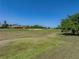 Picturesque golf course view with tree-lined fairways on a sunny day at 13143 Palmilla Cir, Dade City, FL 33525