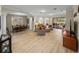 Bright and open living room featuring hardwood floors, neutral walls, and ample natural light at 13143 Palmilla Cir, Dade City, FL 33525