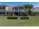 Expansive lawn and screened lanai enhance outdoor living at this two-story home at 13143 Palmilla Cir, Dade City, FL 33525