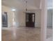 Bright dining room with travertine floors, pillar accents, and a stylish chandelier at 14115 Harborwood Dr, Largo, FL 33774