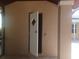 Exterior door showing the door frame and stucco texture at 14115 Harborwood Dr, Largo, FL 33774