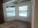 Bright room features large windows offering a view of a beautiful pool area at 14115 Harborwood Dr, Largo, FL 33774