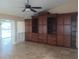 Living area featuring a full wall of custom built-in wood cabinets and drawers at 14115 Harborwood Dr, Largo, FL 33774