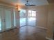 Light-filled room with tile flooring and French doors leading to a pool area at 14115 Harborwood Dr, Largo, FL 33774