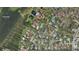 Aerial neighborhood view with lush landscaping, intercoastal access, and well maintained homes at 14115 Harborwood Dr, Largo, FL 33774