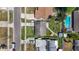 Birds eye view of property with well maintained yard, patio with umbrella, and pool nearby at 1734 Shore Acres Ne Blvd, St Petersburg, FL 33703