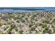 High aerial shot showing homes in a waterfront community with islands and lush mature trees at 1734 Shore Acres Ne Blvd, St Petersburg, FL 33703