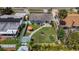 Aerial view showcases the home's backyard with patio seating, garden, and well-maintained lawn at 1734 Shore Acres Ne Blvd, St Petersburg, FL 33703