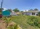Beautiful backyard with a garden, patio area, and shed at 1734 Shore Acres Ne Blvd, St Petersburg, FL 33703
