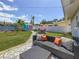 Spacious backyard featuring an outdoor seating area and a charming, colorful garden shed at 1734 Shore Acres Ne Blvd, St Petersburg, FL 33703