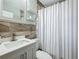 Bathroom features modern fixtures, stylish tiling, updated vanity, and shower with elegant decor at 1734 Shore Acres Ne Blvd, St Petersburg, FL 33703