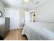 Neutral bedroom featuring a closet, a ceiling fan, and a connecting doorway to a bathroom at 1734 Shore Acres Ne Blvd, St Petersburg, FL 33703