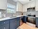 Modern kitchen with tile backsplash and stainless steel appliances at 1734 Shore Acres Ne Blvd, St Petersburg, FL 33703