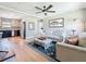 Bright, open-concept living room with wood floors and view to the kitchen at 1734 Shore Acres Ne Blvd, St Petersburg, FL 33703
