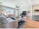 Comfortable living room featuring wood floors, a ceiling fan, and a large window at 1734 Shore Acres Ne Blvd, St Petersburg, FL 33703