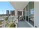Balcony with comfortable seating overlooks city skyline, enhancing outdoor living with views of the surrounding cityscape at 175 1St S St # 1003, St Petersburg, FL 33701